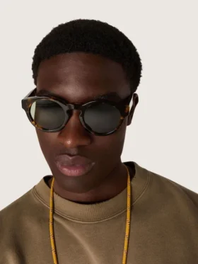 Square style Panthos sunglasses with havana brown frame and green lenses