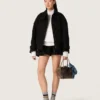 Women’s miniskirt in black cotton twill with floral sequin embroidery