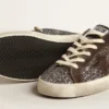 Super-Star in glitter with a brown star and lilac heel tab