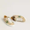 Super-Star LTD in beige leather with green suede star and silver foiled leather heel tab