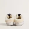 Super-Star Sabots in white leather with shearling lining and silver star