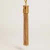 Tassel-shaped charm in antique gold-colored brass
