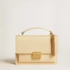 Tassel-shaped charm in antique gold-colored brass