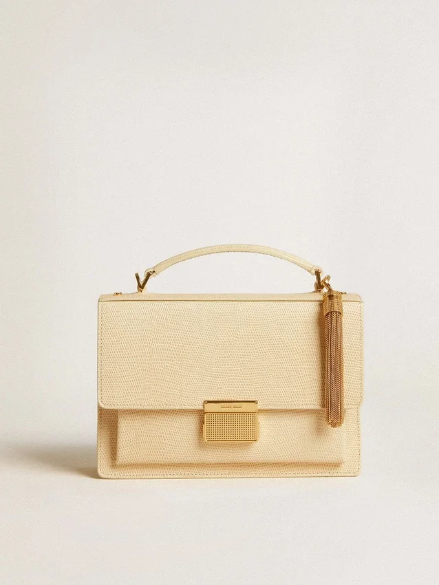 Tassel-shaped charm in antique gold-colored brass