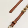 Trinidad belt in aged tan-colored leather with golden maxi studs