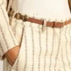 Trinidad belt in aged tan-colored leather with golden maxi studs