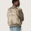 Unisex bomber jacket in green satin with ribbed hems and collar