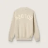 Unisex crew-neck sweater in beige cotton with patch on the front and logo on the back