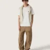 Unisex crew-neck sweater in beige cotton with patch on the front and logo on the back