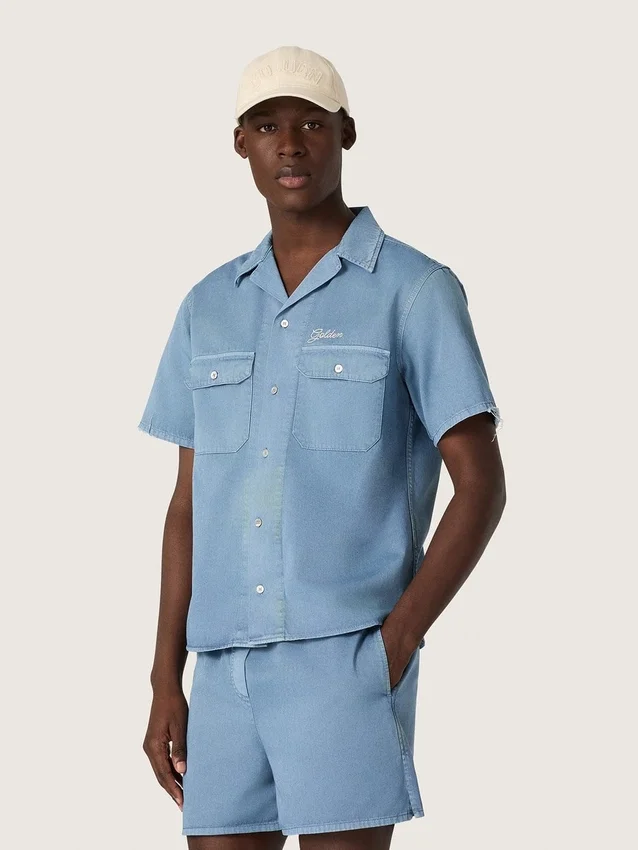 Unisex shirt in light blue denim with embroidery on the back