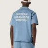 Unisex shirt in light blue denim with embroidery on the back