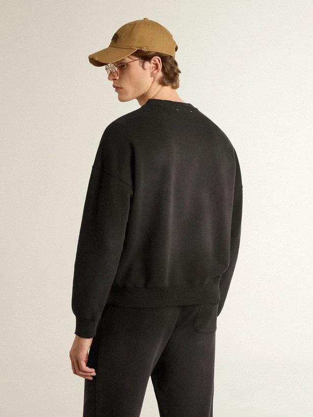 Unisex sweatshirt in worn black cotton with logo embroidery