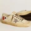 V-Star in ecru nappa with silver nappa star and beaded embroidery