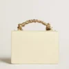 Venezia Bag in butter-colored boarded leather with silk scarf