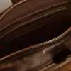 Vita Bag in black distressed leather with gold details