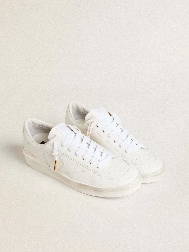 White cotton laces with contrasting gold logo