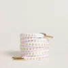 White cotton laces with contrasting gold stars