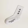 White socks with contrasting black stars