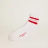 White socks with distressed details and red stripes