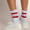 White socks with distressed details and red stripes