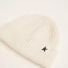 White wool beanie with black star