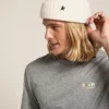 White wool beanie with black star