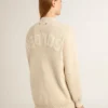 Women’s beige cardigan with 'Golden' lettering on the back