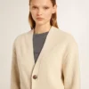 Women’s beige cardigan with 'Golden' lettering on the back