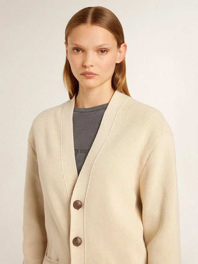 Women’s beige cardigan with 'Golden' lettering on the back