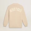 Women’s beige cardigan with 'Golden' lettering on the back