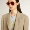 Women's beige pinstripe single-breasted jacket with an oversized fit