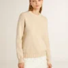 Women's beige sweater with 'Golden' lettering on the back