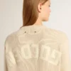 Women's beige sweater with 'Golden' lettering on the back