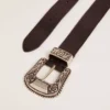 Women's belt in black leather with silver decorated buckle