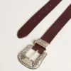 Women’s belt in burgundy leather with decorated silver buckle