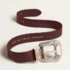 Women’s belt in burgundy leather with decorated silver buckle