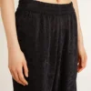 Women's black joggers with a tone-on-tone toile de jouy print