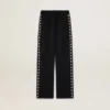 Women’s black joggers with white stars on the sides