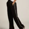 Women’s black joggers with white stars on the sides