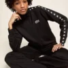 Women’s black zipped sweatshirt with white stars