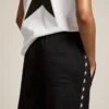 Women’s black joggers with white stars on the sides