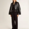Women's black shirt with vertical stripes and side knot closure