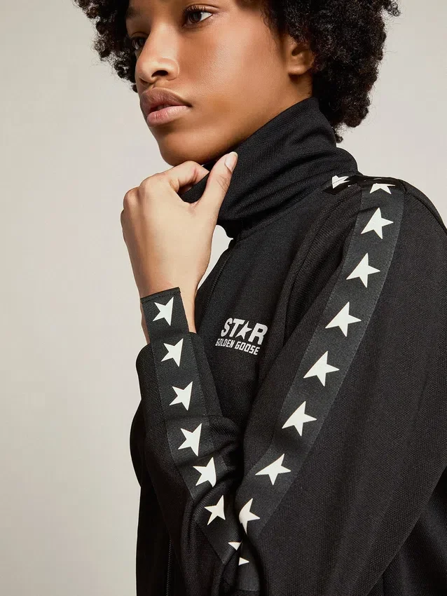 Women’s black zipped sweatshirt with white stars