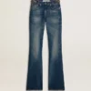 Women's bootcut jeans with a vintage wash and metallic details