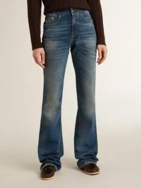 Women’s bootcut jeans with a vintage wash and metallic details