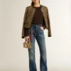 Women's bootcut jeans with a vintage wash and metallic details