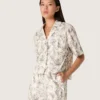 Women's boxy cotton shirt with black and white floral print