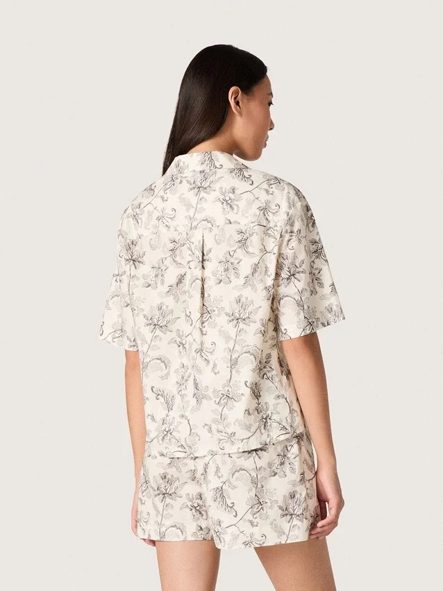 Women's boxy cotton shirt with black and white floral print