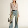 Women's boyfriend jeans with a lived-in effect sand wash and studs