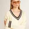 Women's cable-pattern cropped sweater with blue ribbing and crystals
